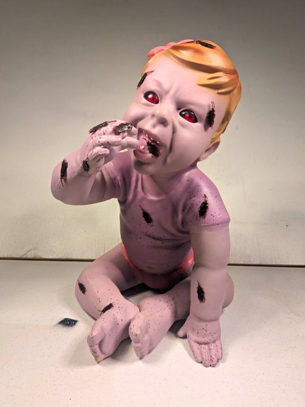 Spirit Halloween Ravenous Ruby Zombie Baby Prop Eating Cockroaches Decoration